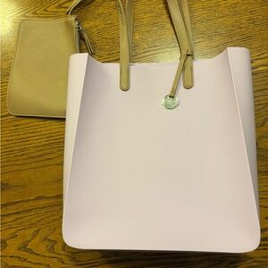 Light purple Fablou London light pink silicone Tote Bag with a small purse.